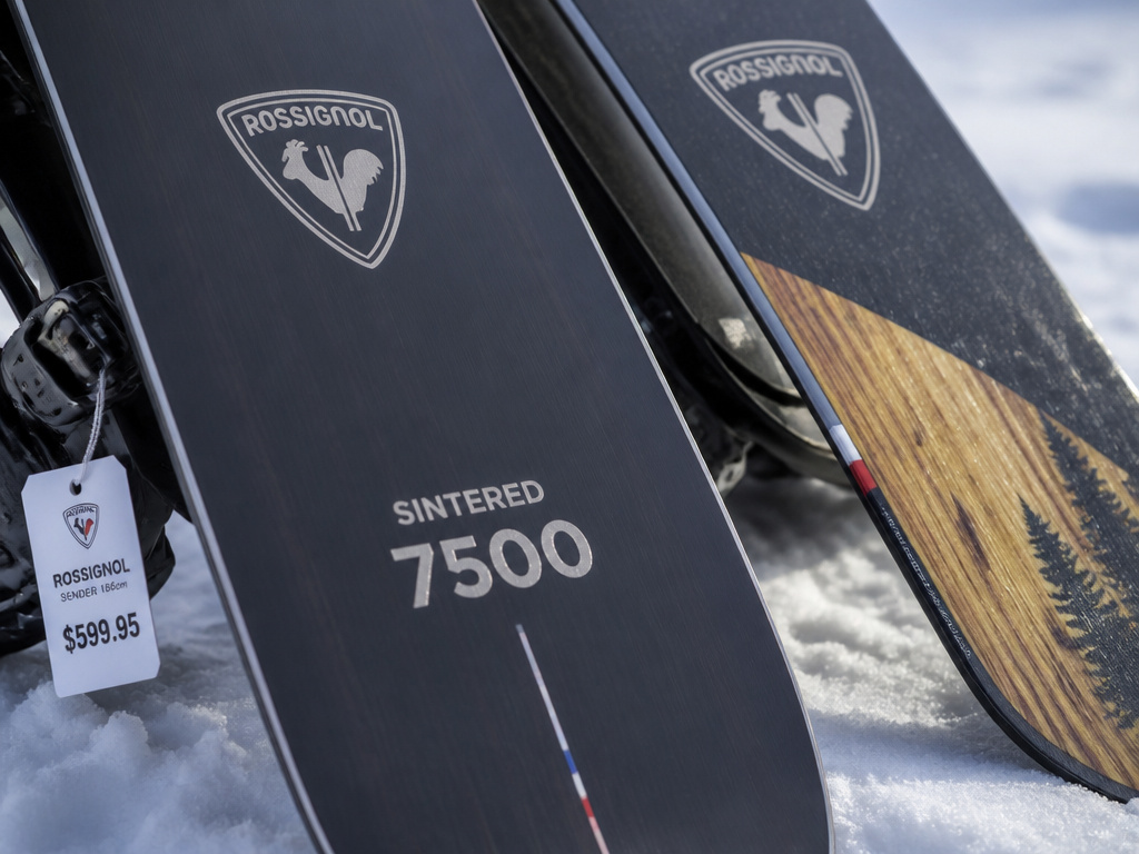 Close-up comparing Rossignol snowboard base materials and construction for value.