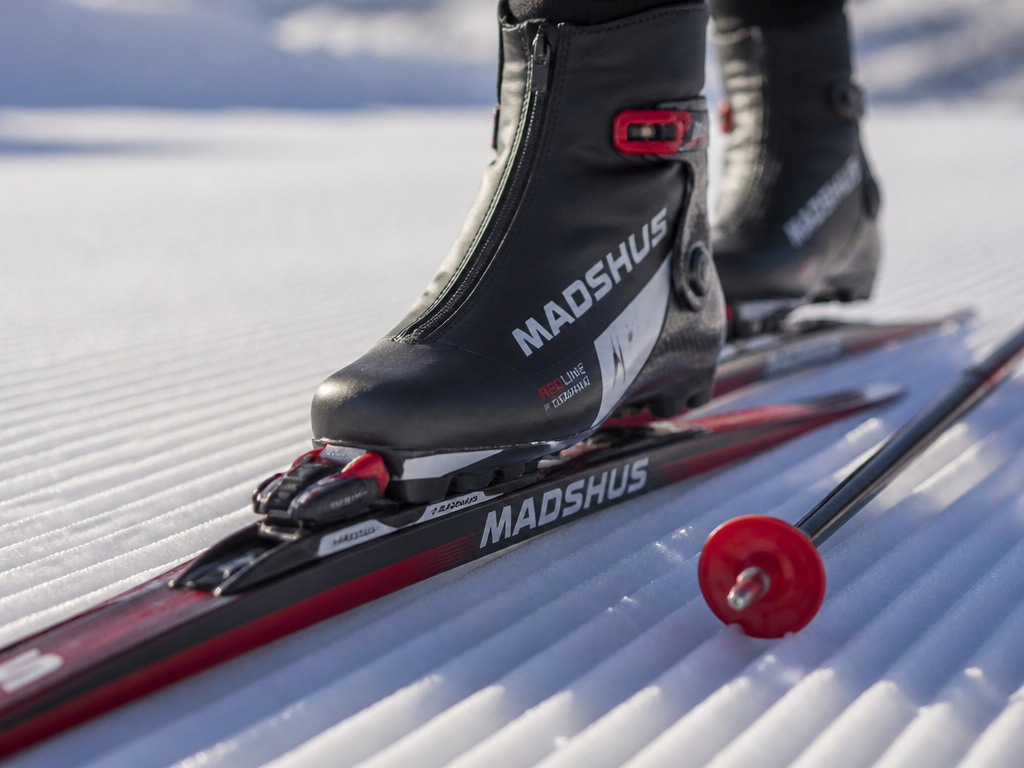Ski skate equipment on a groomed slope for a gear review.