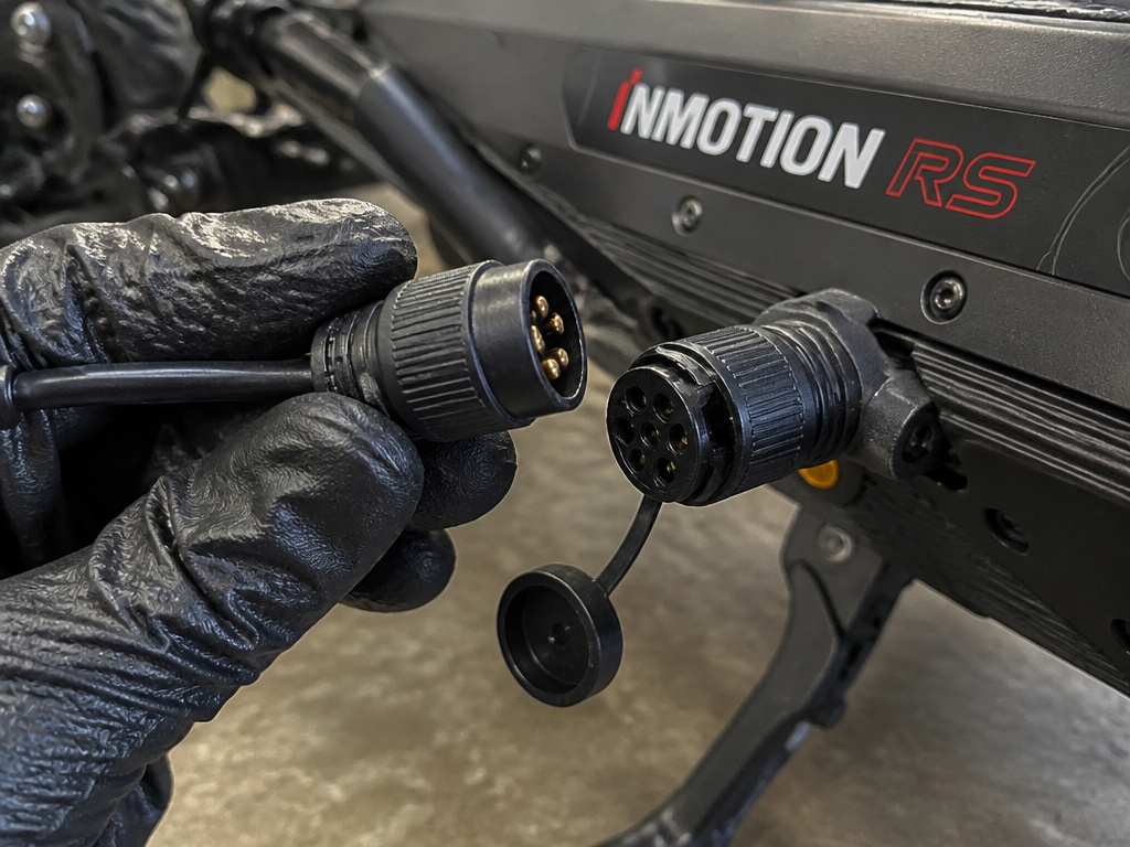 INMOTION RS scooter's disconnected motor cable and quick-release plug.