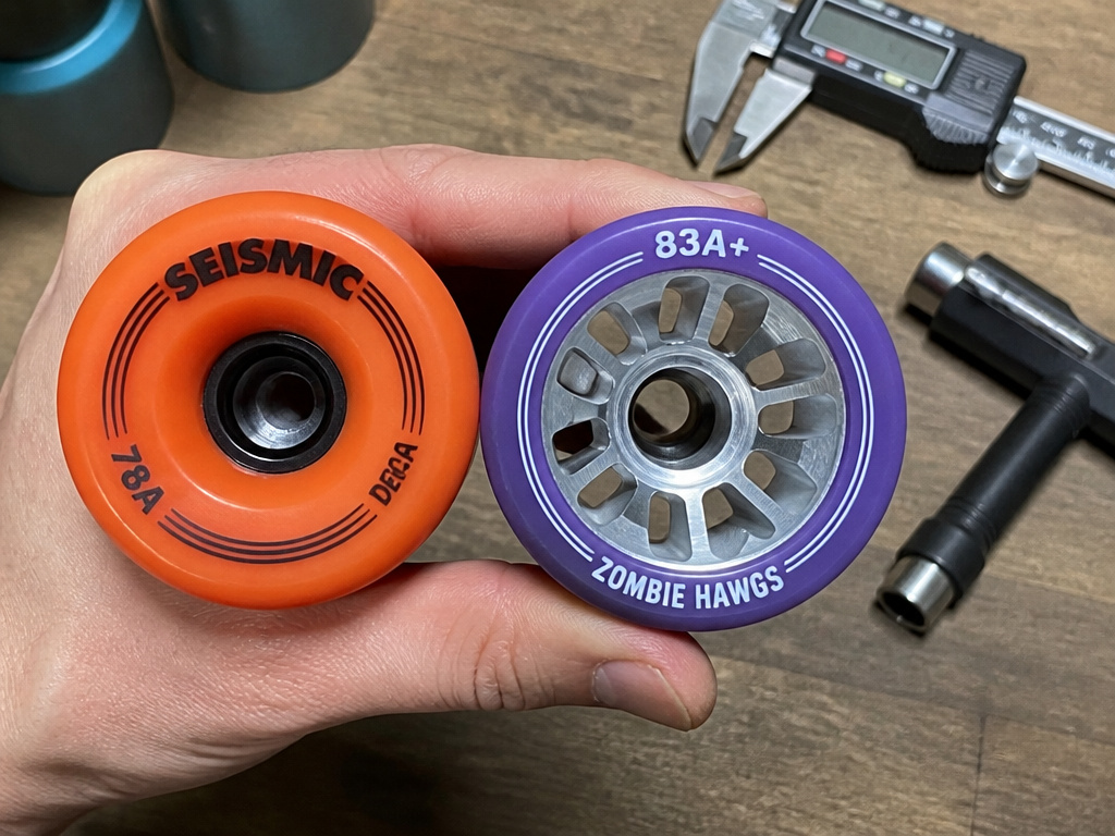 Comparing hard versus soft longboard wheel durometer and core design.