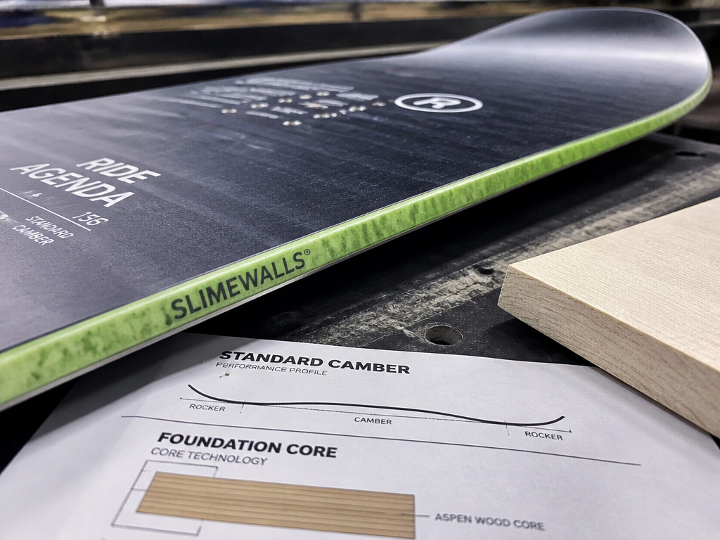 Close-up details of Ride Agenda snowboard camber profile and construction materials.