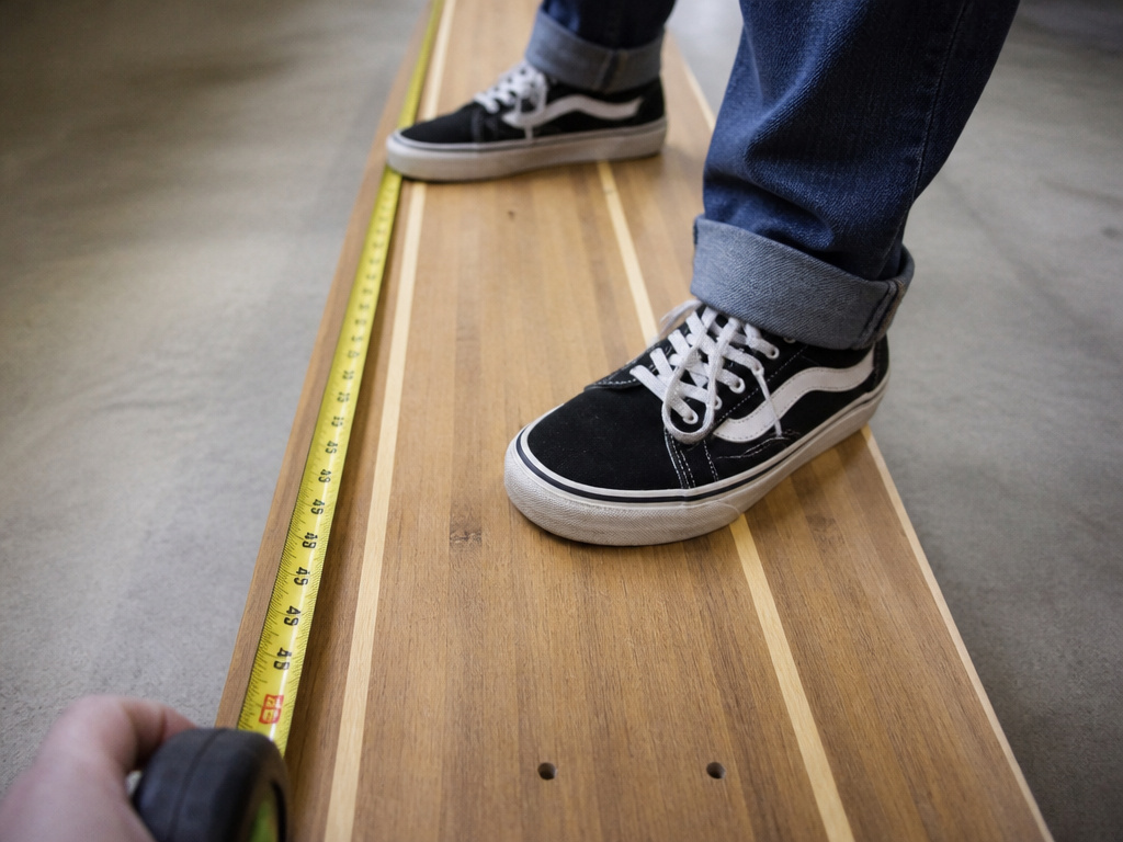 Long dancer longboard for tall rider, showing footwork and measuring length.