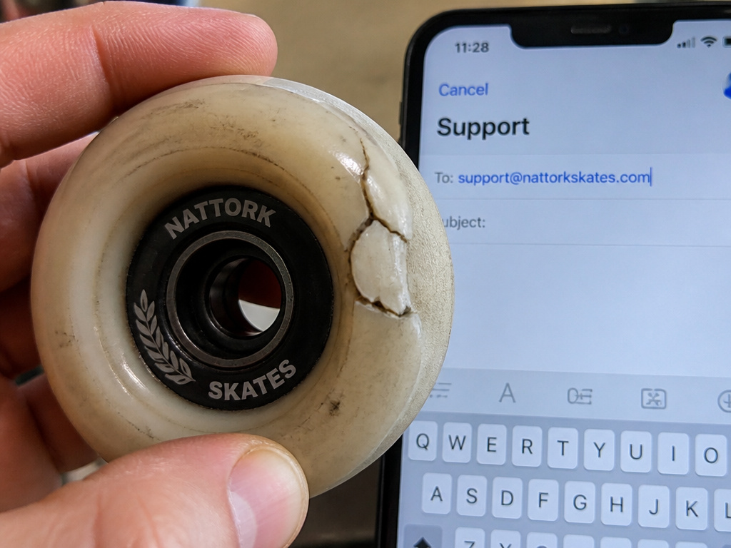 Broken Nattork skate wheel next to an email request for replacement parts