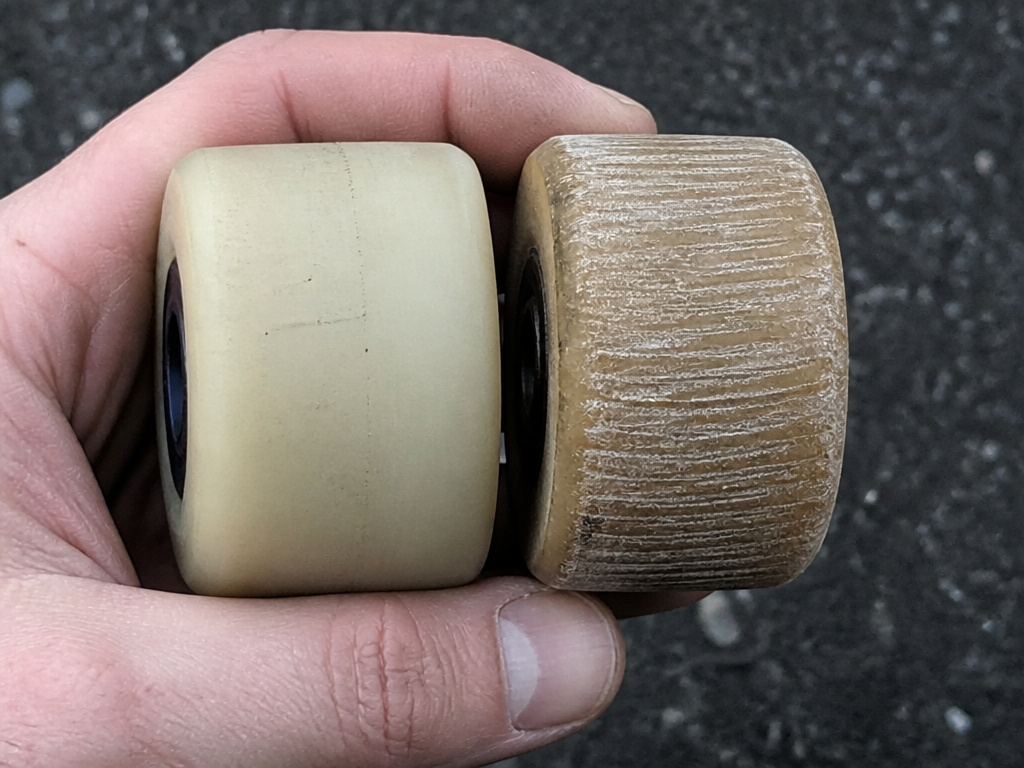 Comparison of worn hard versus soft longboard wheels on pavement.