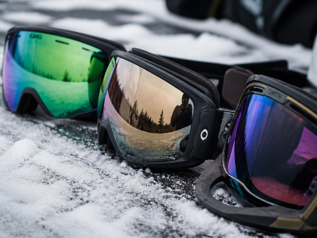 Comparison of top snowboard goggle brands showing lens shapes and magnetic features.