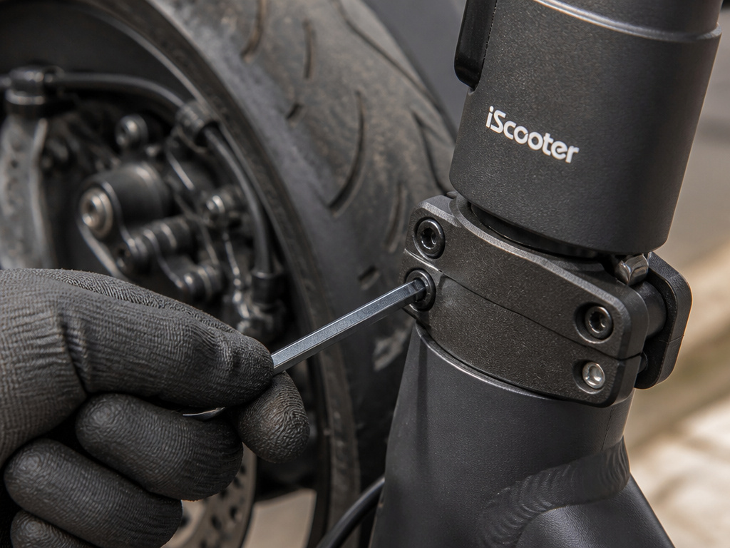 Maintaining an iScooter ix3 scooter by tightening the steering stem clamp bolt.
