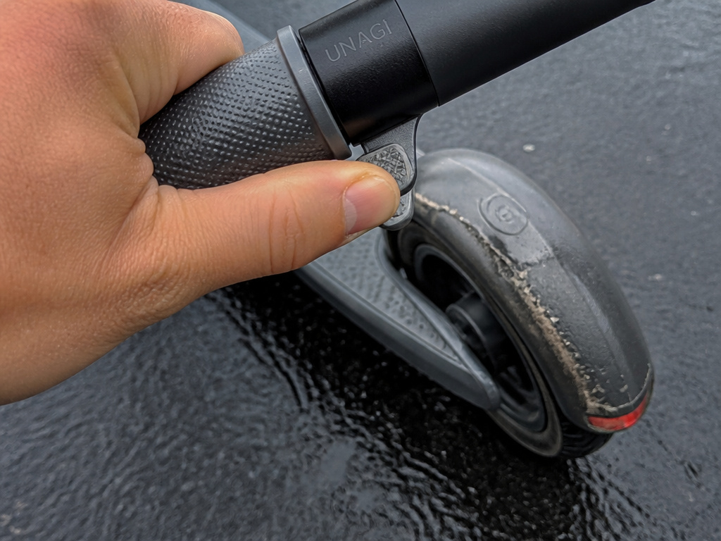 Unagi scooter thumb brake and worn rear fender brake on wet road