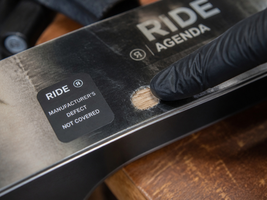 RIDE Agenda snowboard warranty coverage for defects versus rock damage