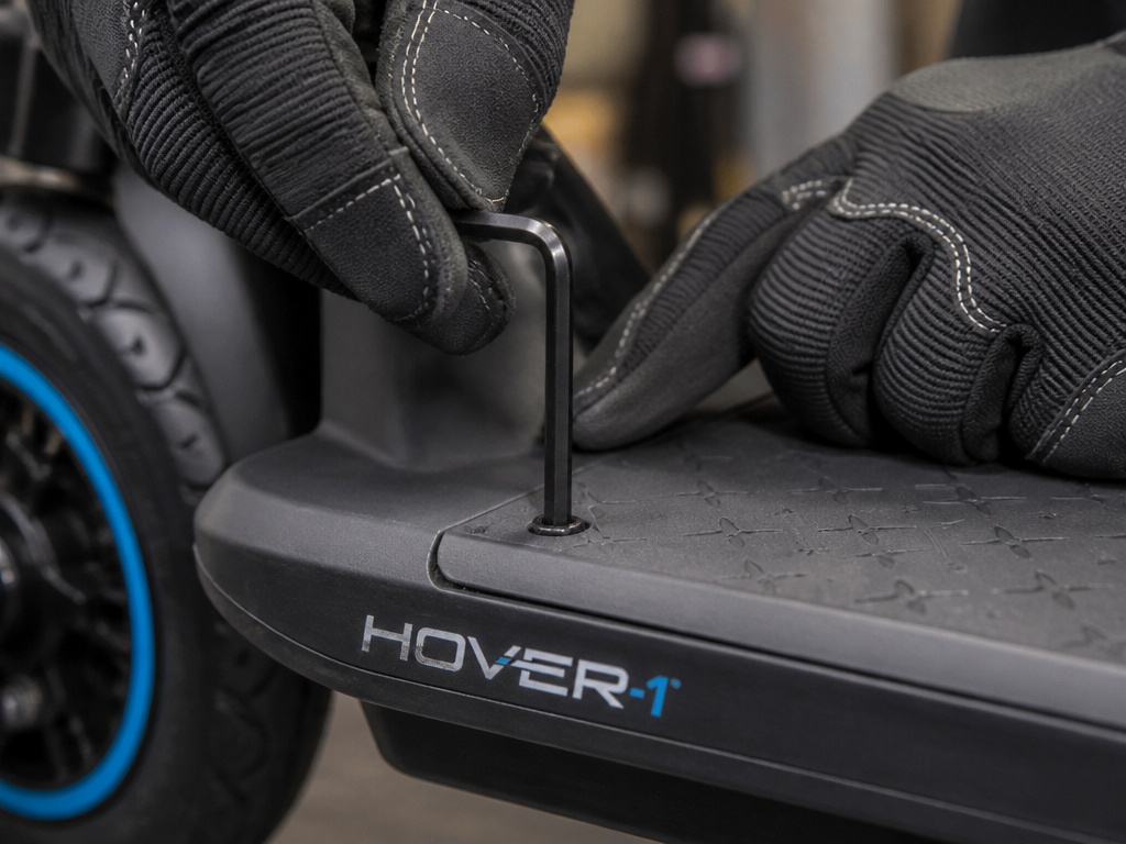 Disconnecting the battery on a Hover 1 scooter for a hard reset.