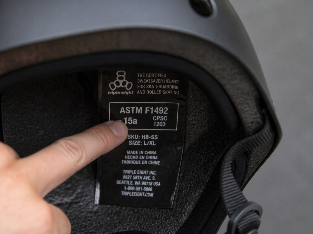 Close-up of ASTM F1492 certification label inside a skate helmet.