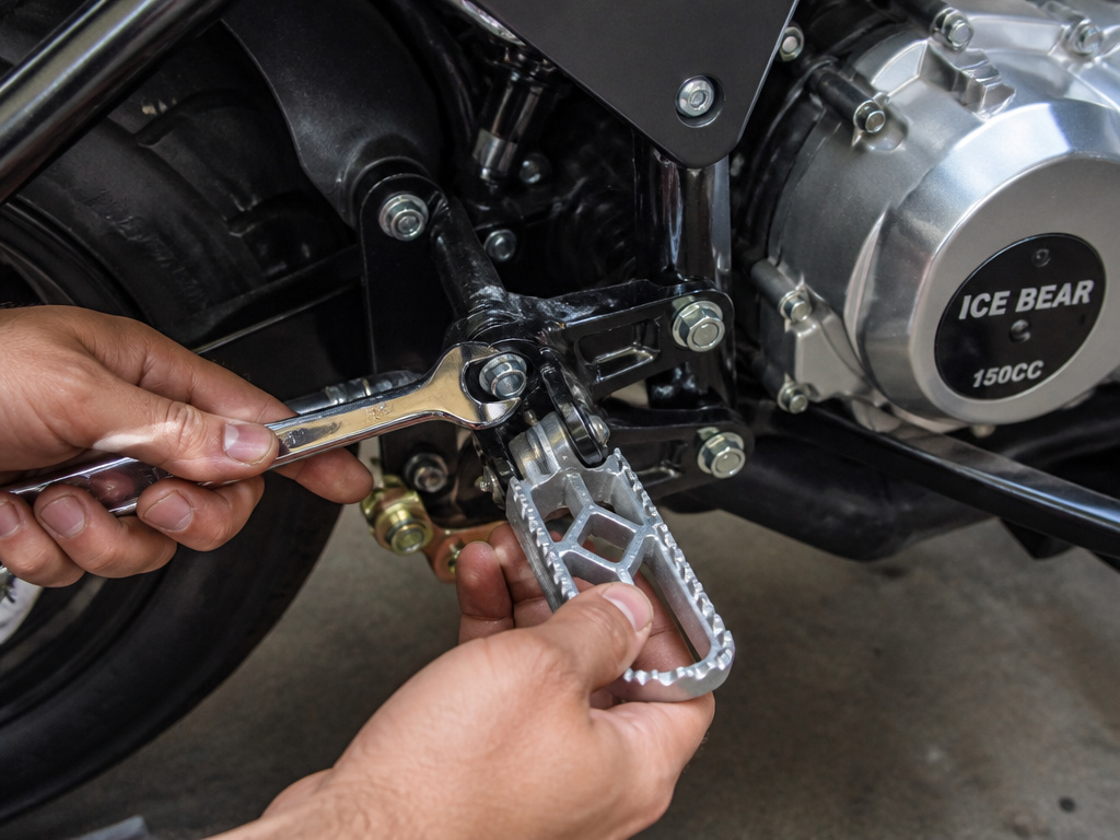 Final assembly and fastener check on an Ice Bear 150cc Maddog scooter.