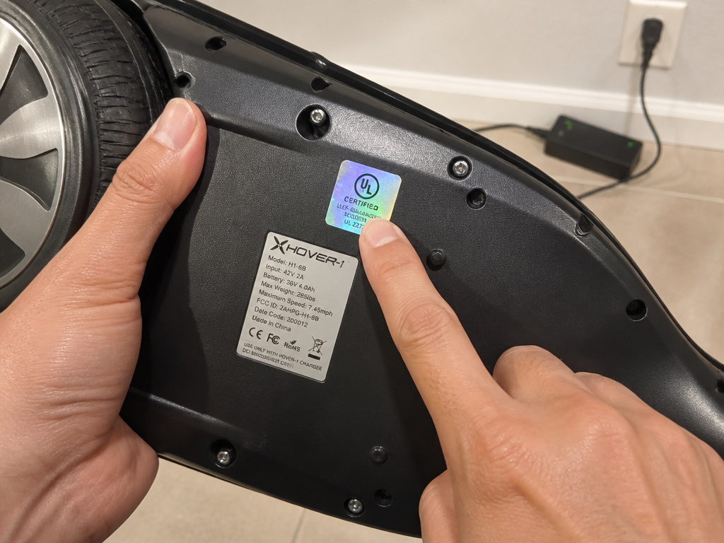 Close-up of verifying the UL 2272 safety label on a Bluetooth hoverboard.